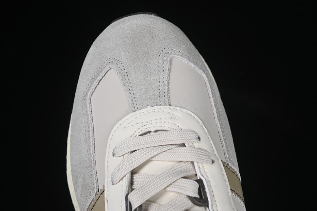 Top-down detail of the grey toe and lace-up front