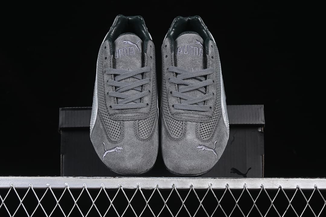 Front view of the pair of gray Puma sneakers