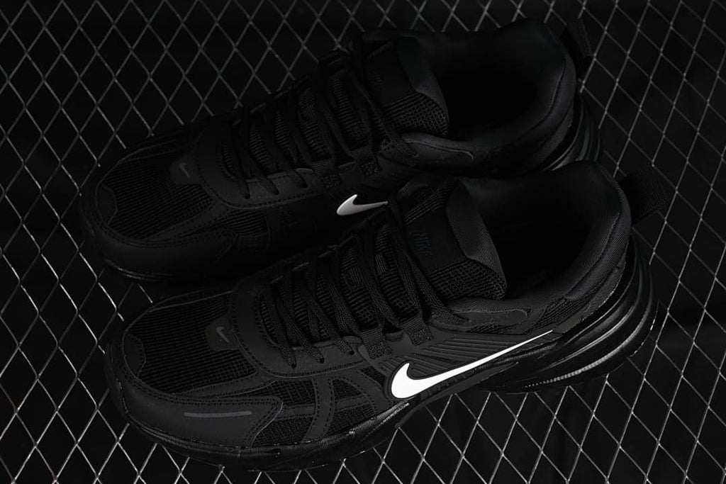 Pair of black Nike V2K Run sneakers shown from above at an angle.
