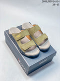 Olive green ECCO two-strap sandals with molded footbeds on a branded box.