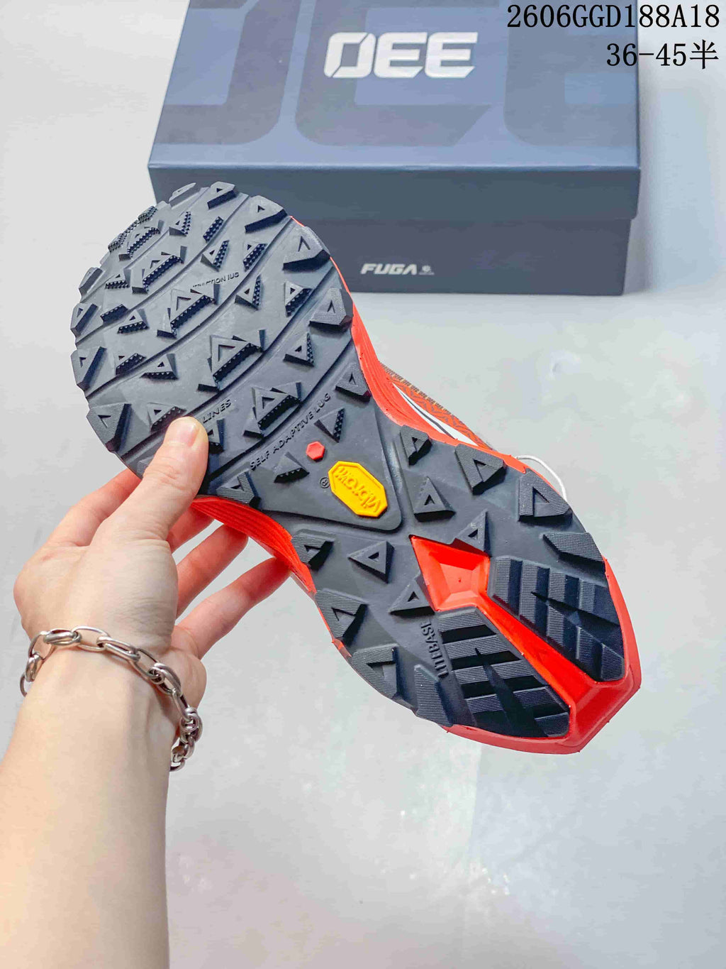Close-up of the trail shoe outsole with prominent lugs and a Vibram mark