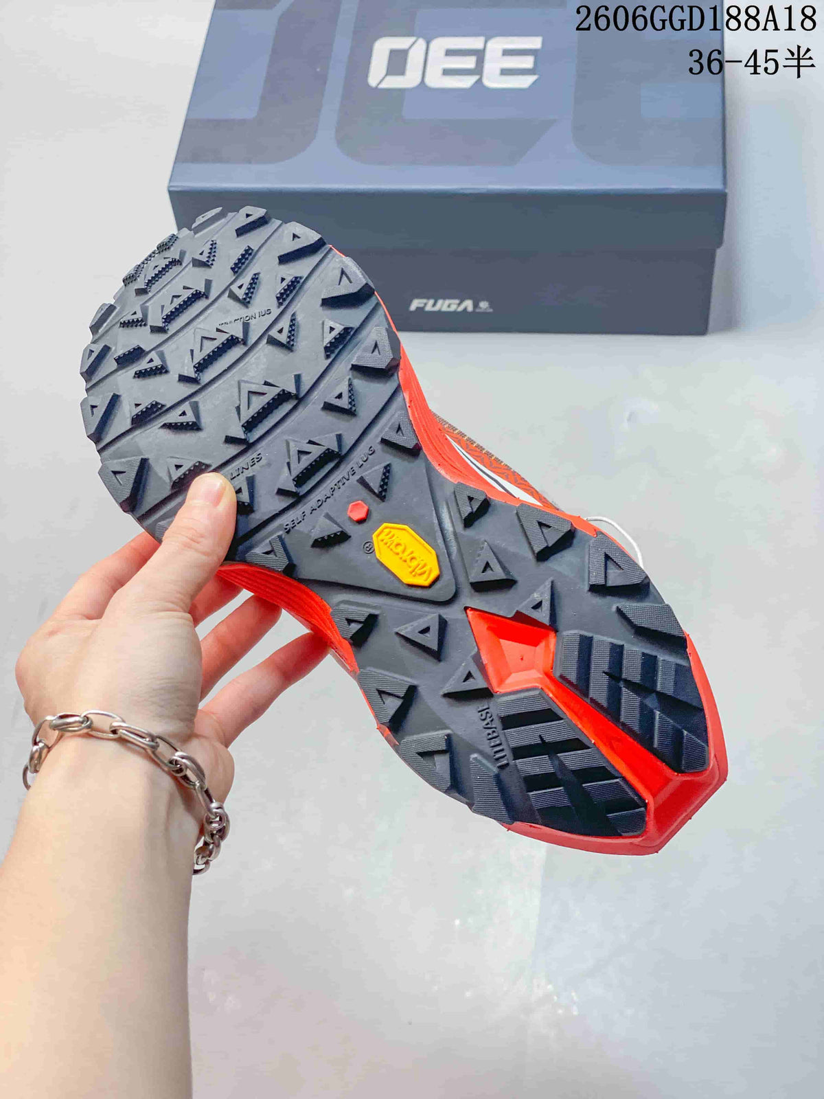 Close-up of the trail shoe outsole with prominent lugs and a Vibram mark