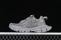 Side view of a grey Balenciaga Phantom sneaker with an openwork upper and gold-tone details.