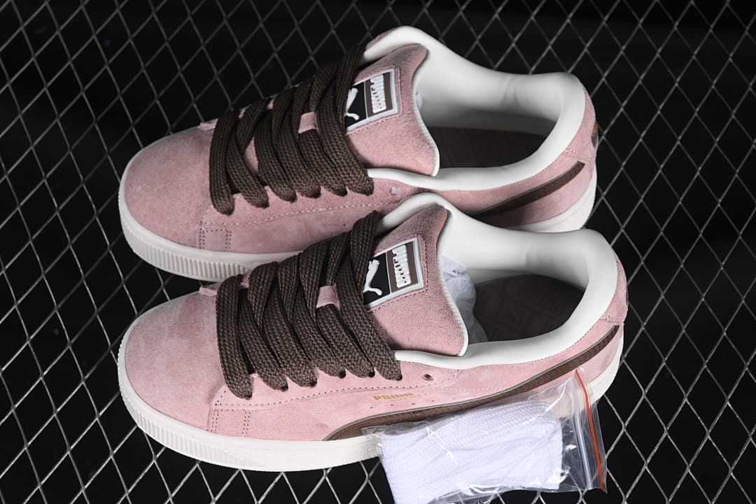 Pair of pink and brown Puma Suede XL sneakers shown from above.
