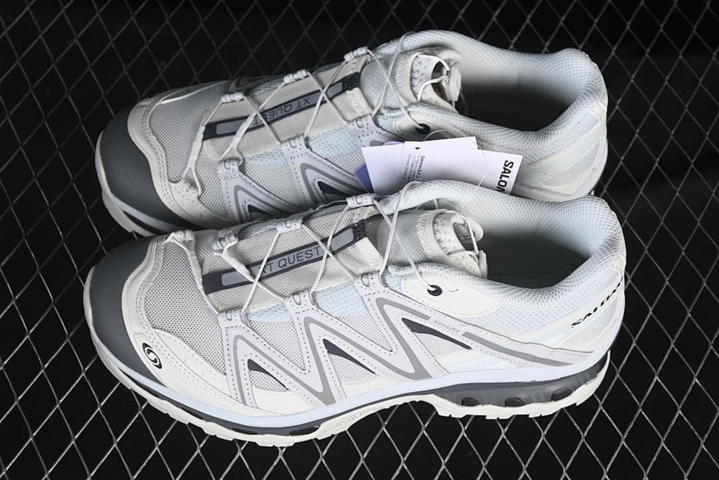 Pair of white and grey Salomon XT-Quest shoes shown from above