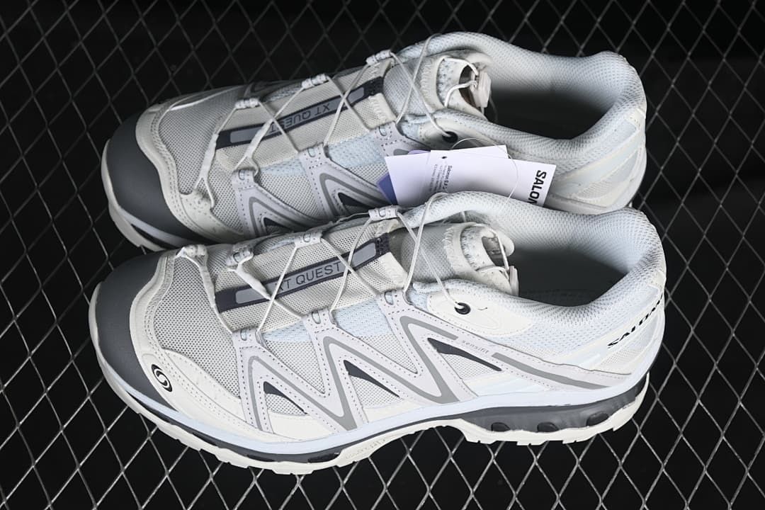 Pair of white and grey Salomon XT-Quest shoes shown from above