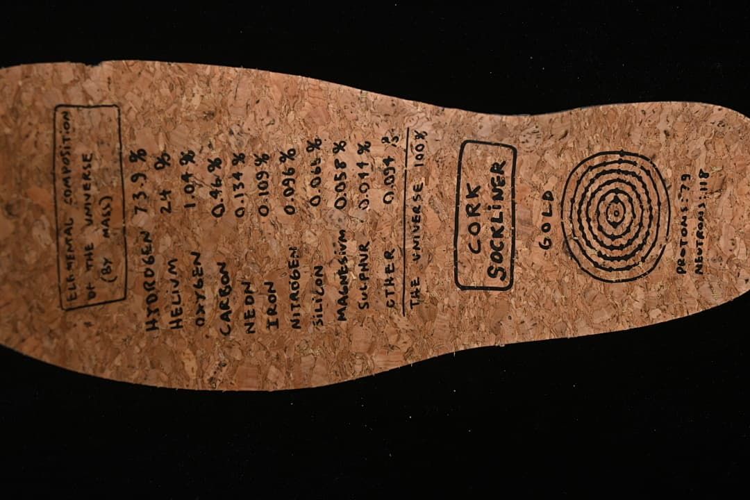 Cork-colored insole with printed composition-style graphics