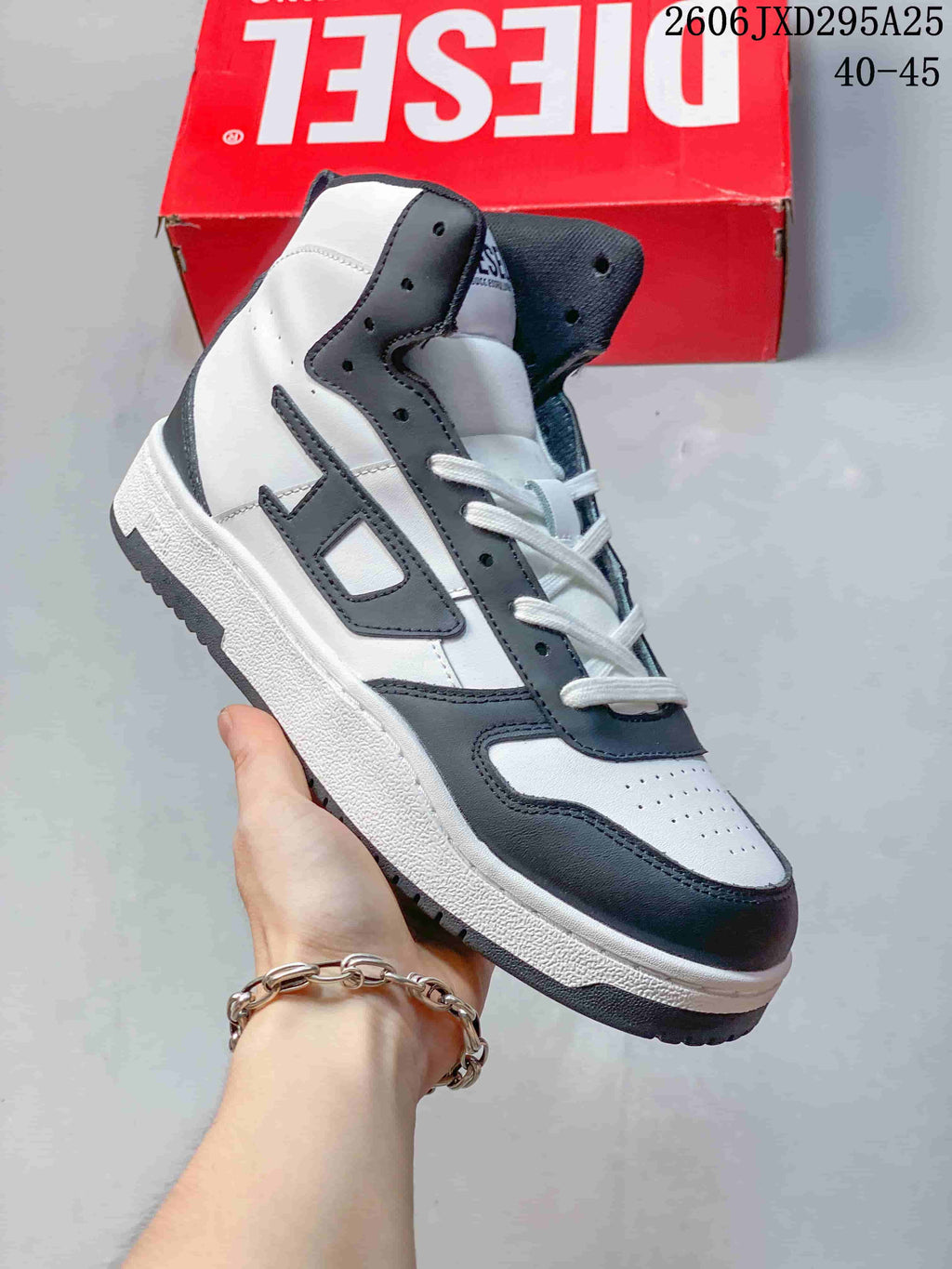 White Diesel S-Ukiyo high-top sneaker with dark charcoal accents.