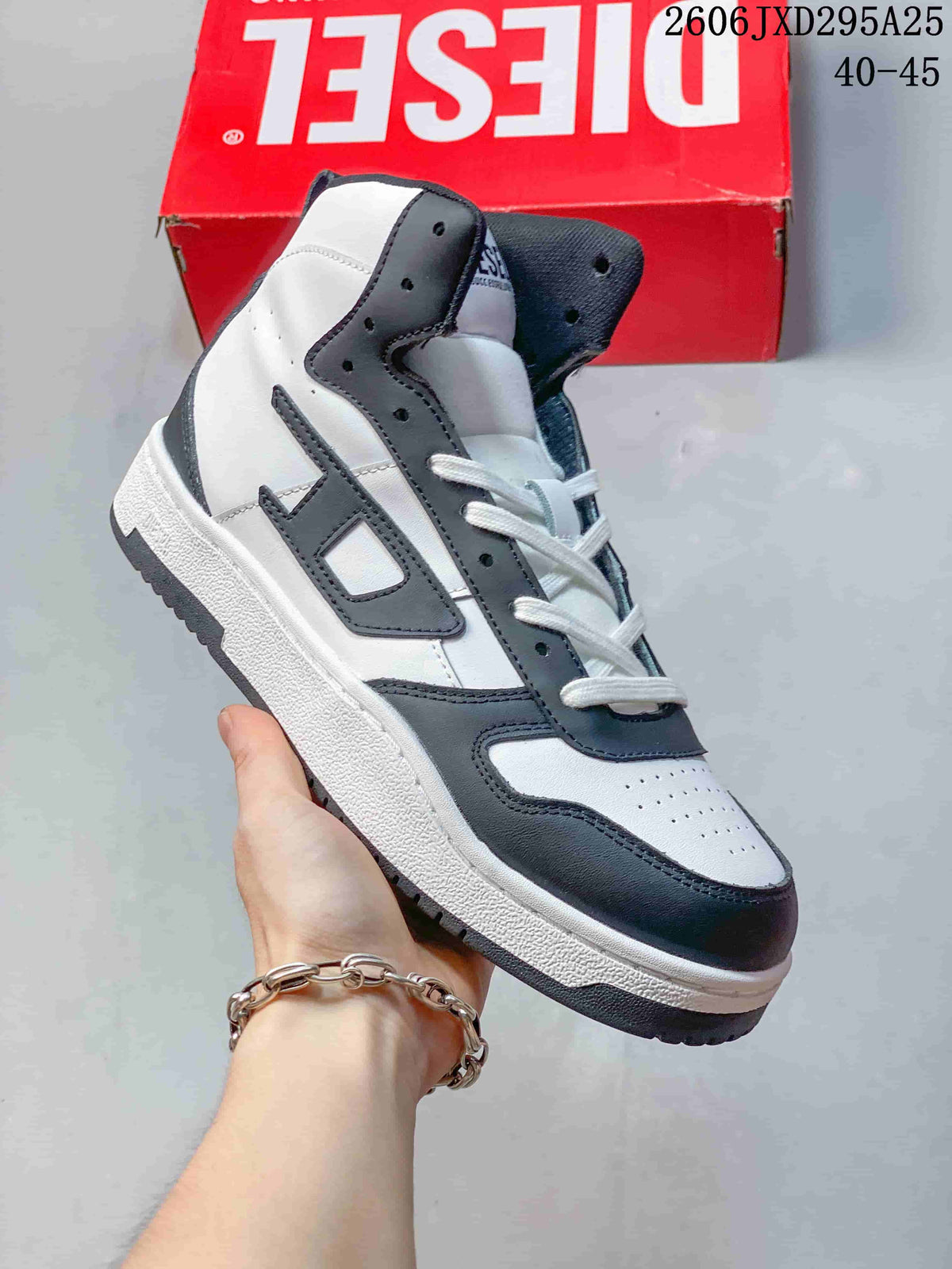 White Diesel S-Ukiyo high-top sneaker with dark charcoal accents.