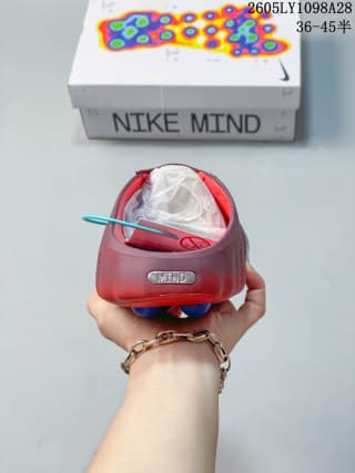 Heel view of the red Nike Mind 001 mule with a Mind badge.