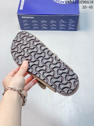 Outsole view showing the patterned tread and cork-look edge of the clog.