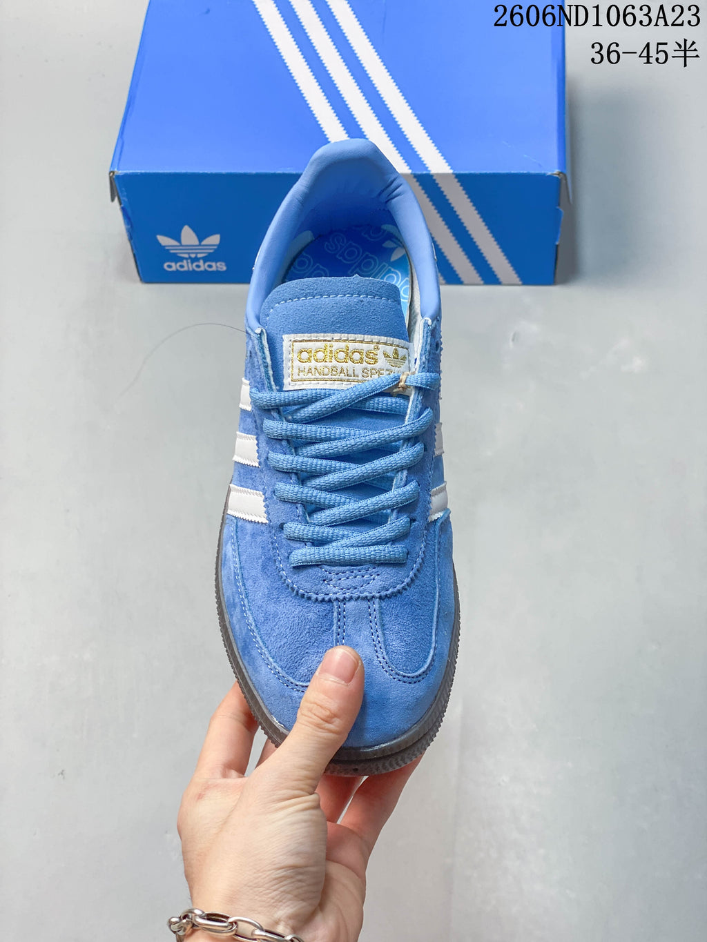 Top view showing the blue laces, tongue, and rounded toe