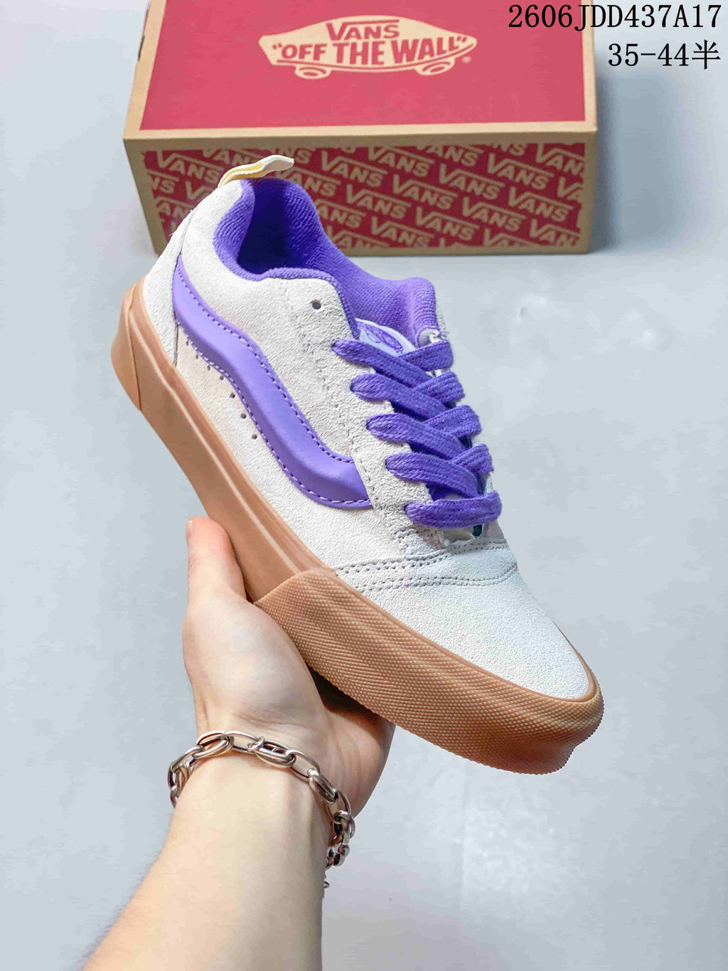 Angled side view of a gray and purple Vans Knu Skool sneaker with a gum-colored sole.