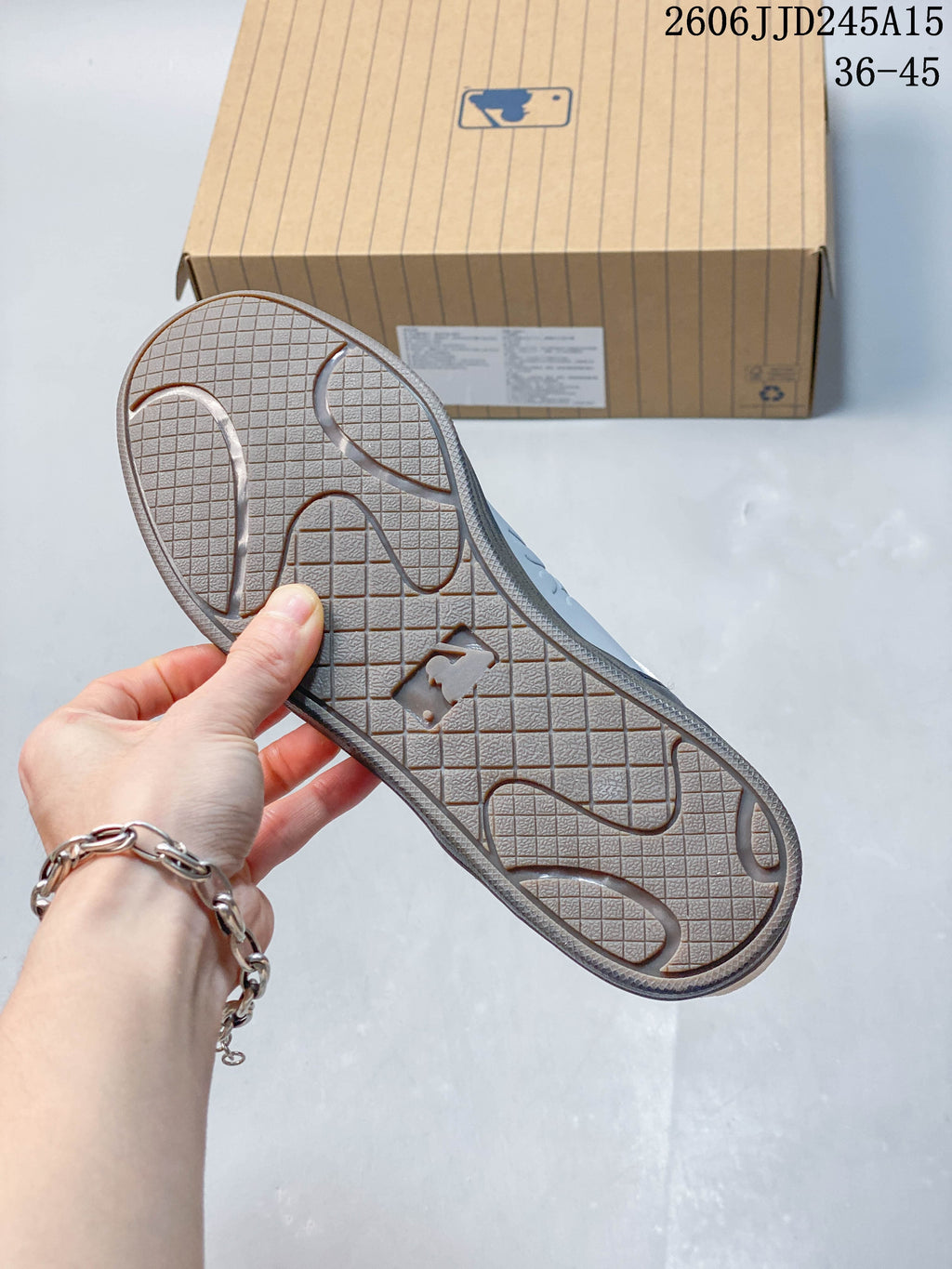 Close-up of the sneaker outsole with grid-pattern tread