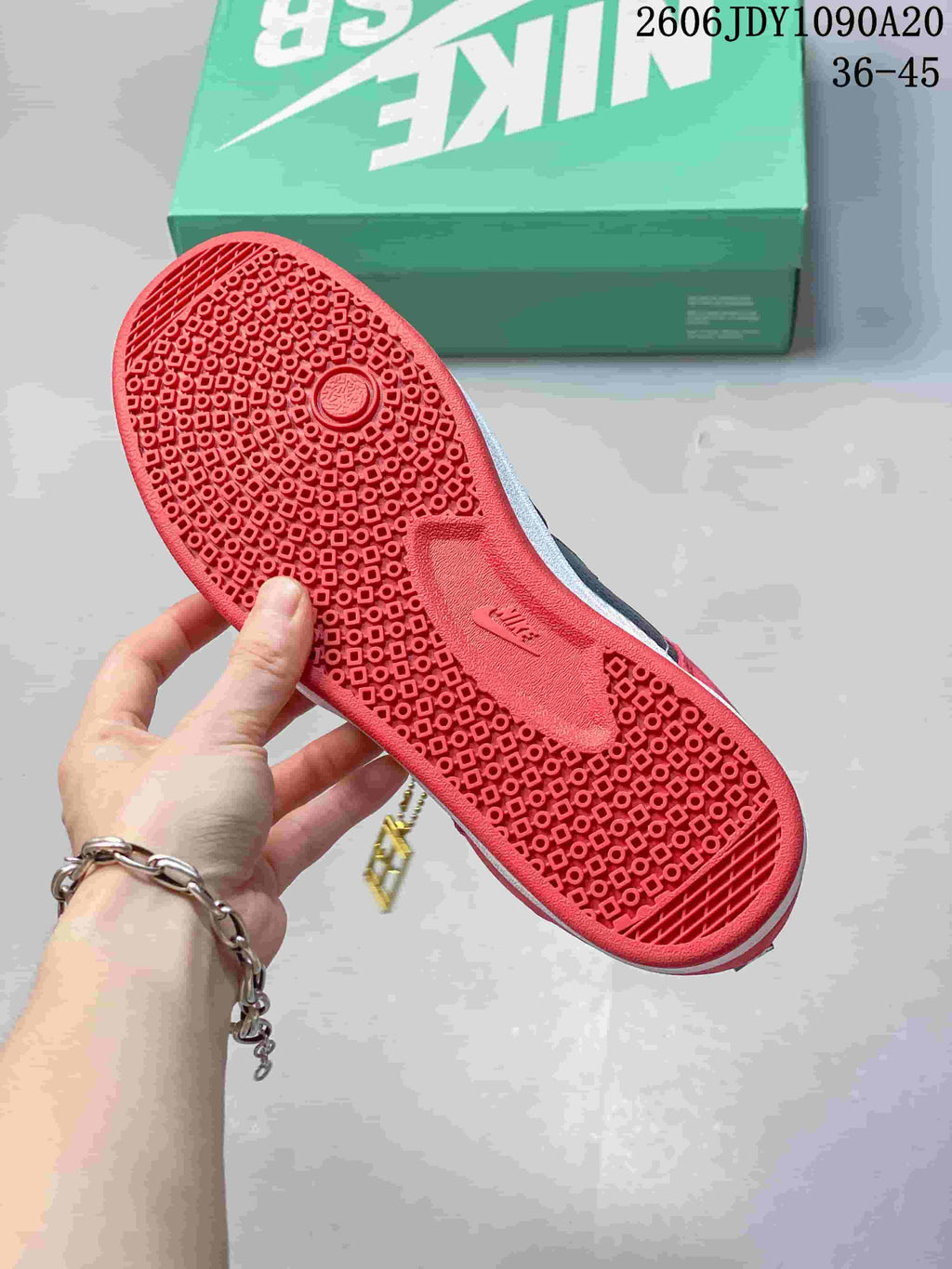 Close-up of the red patterned outsole on a Nike SB Alleyoop sneaker