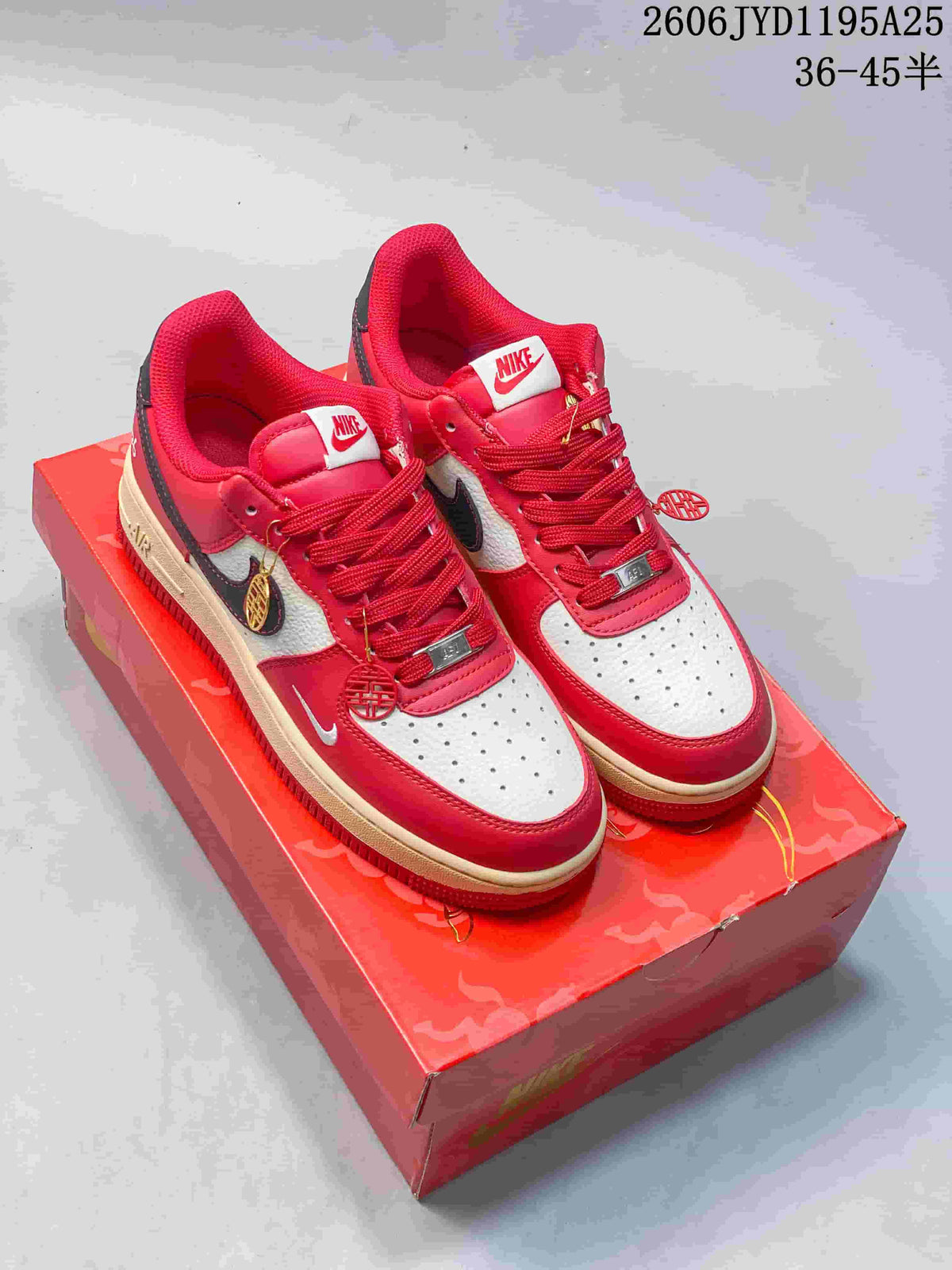 Red-and-white low-top sneakers with dark side accents and decorative lace details