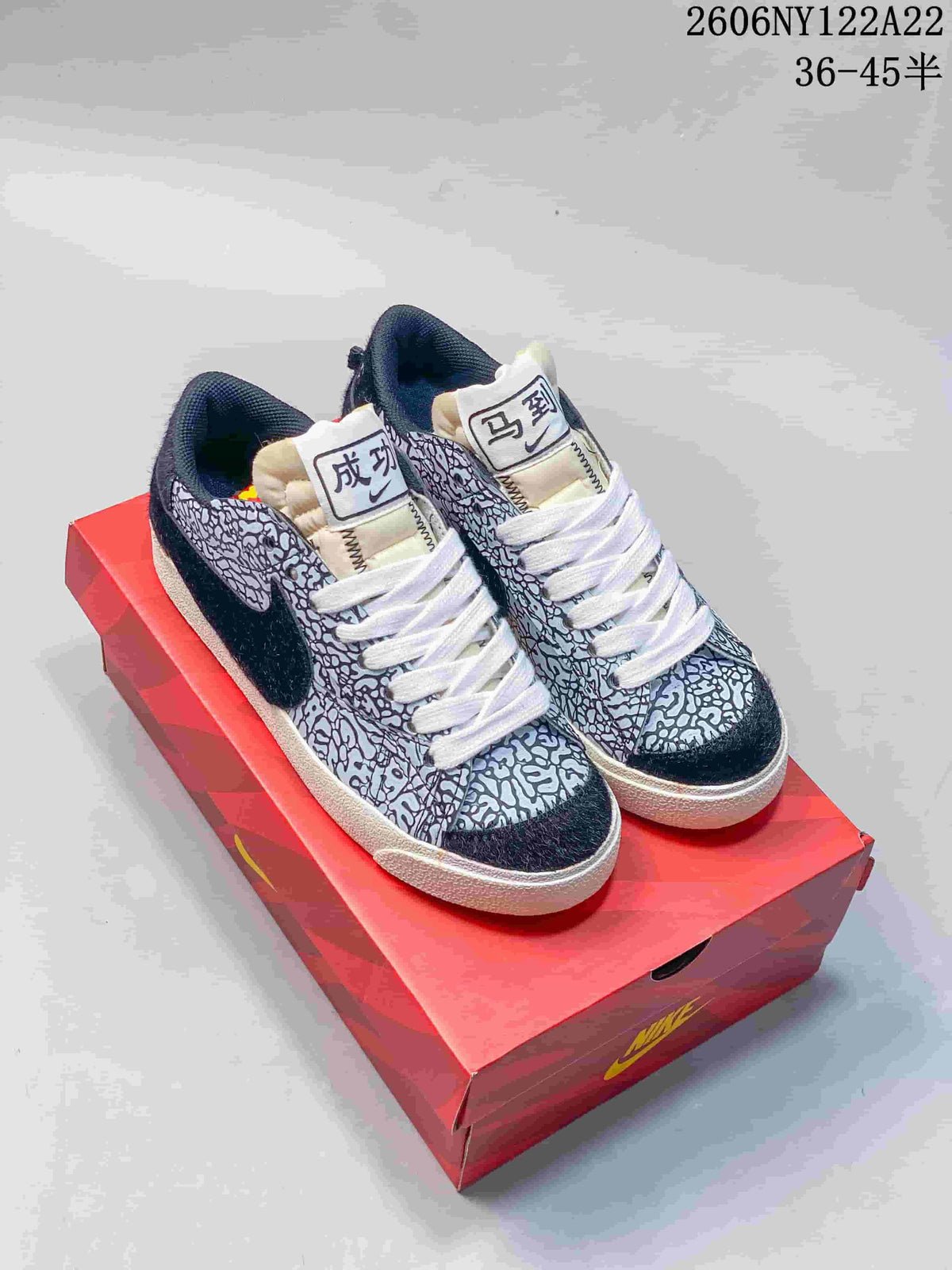 Black-and-white patterned low-top sneakers with white laces