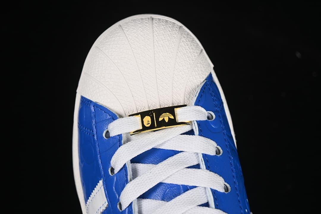 Top view of toe, laces and gold-tone lace accent