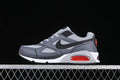 Side view of a grey and black Nike Air Max Correlate sneaker with red heel accent