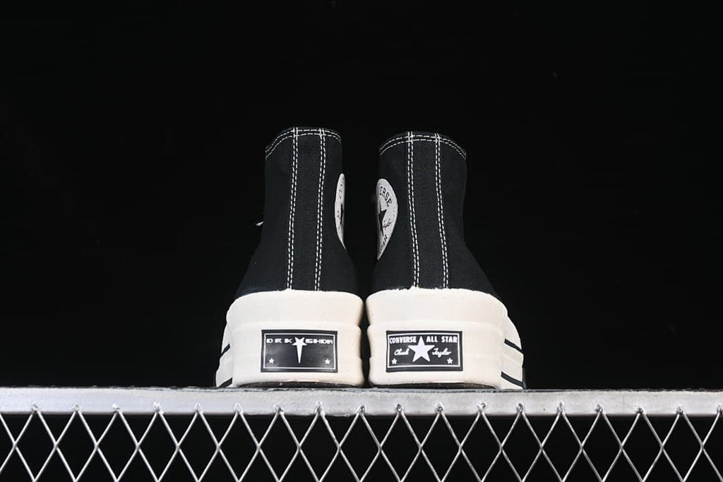 Rear view of both sneakers showing contrasting heel labels