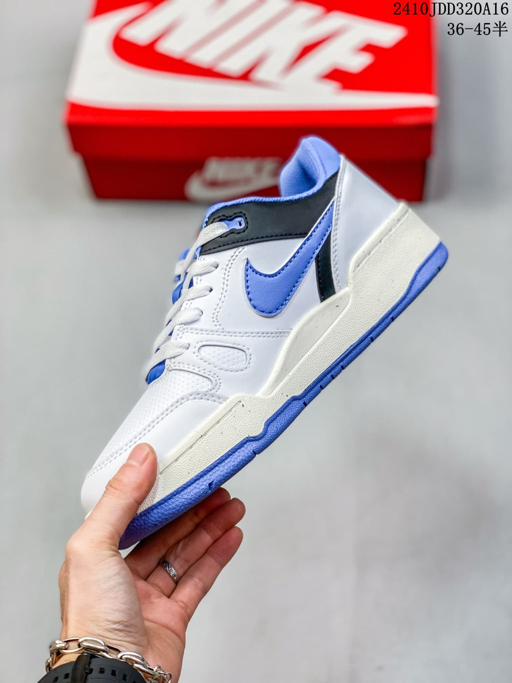 Side profile of a white Nike Full Force Low sneaker with blue and black accents.