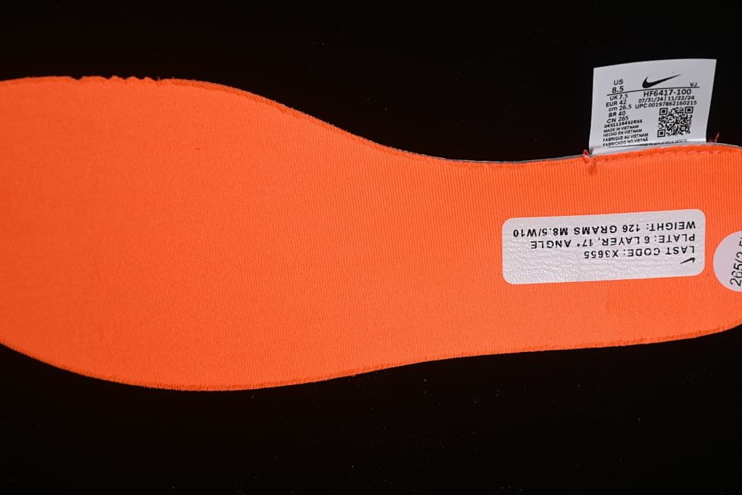 Close-up of the orange insole and shoe size label.