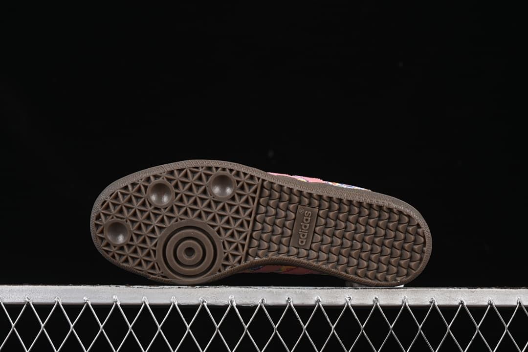 Underside view of the dark brown textured rubber outsole