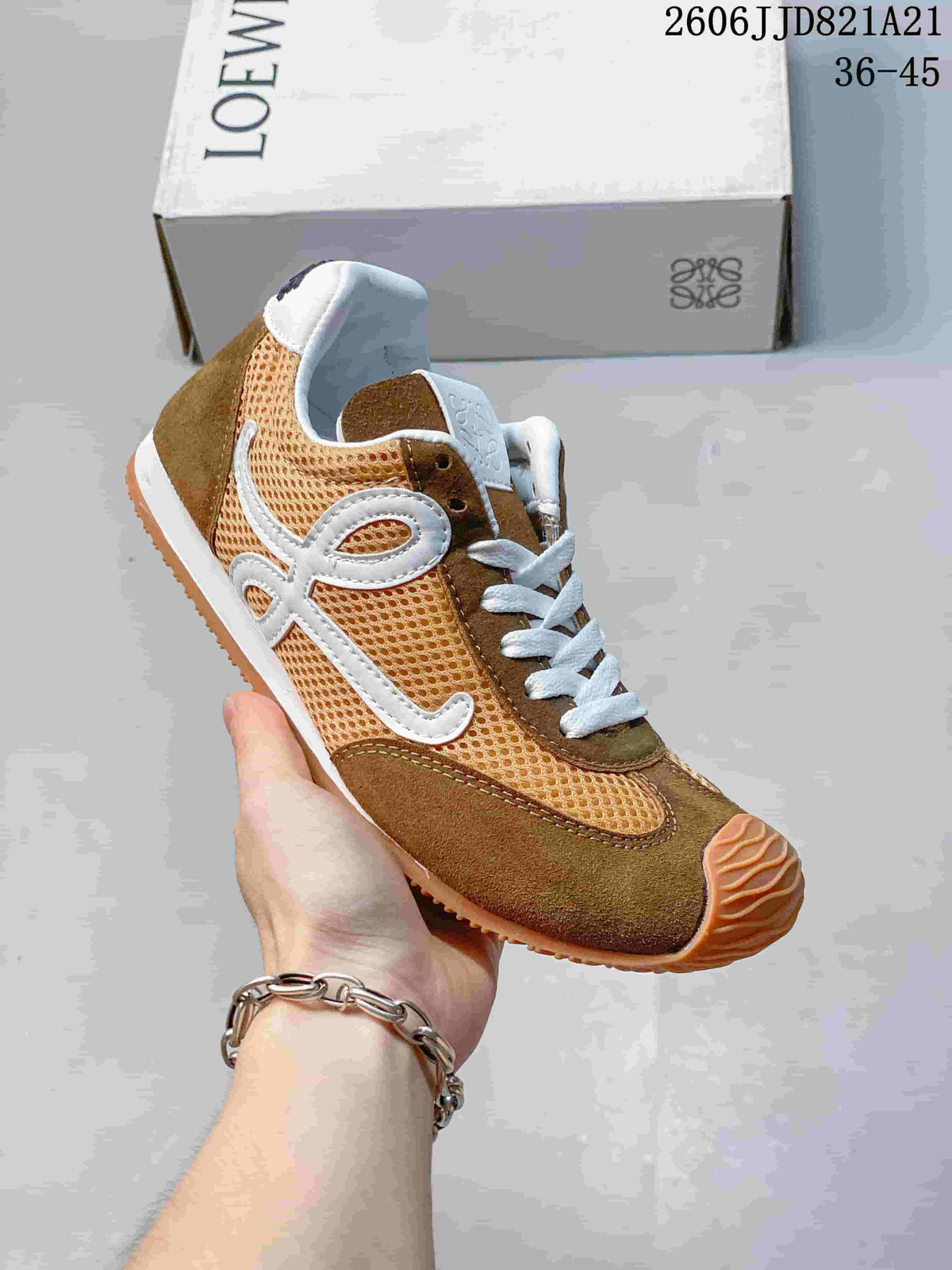 Side view of a brown and tan mesh sneaker with white side detailing