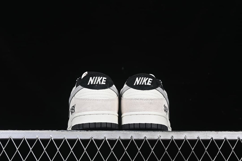 Rear view of both sneakers showing black heel tabs