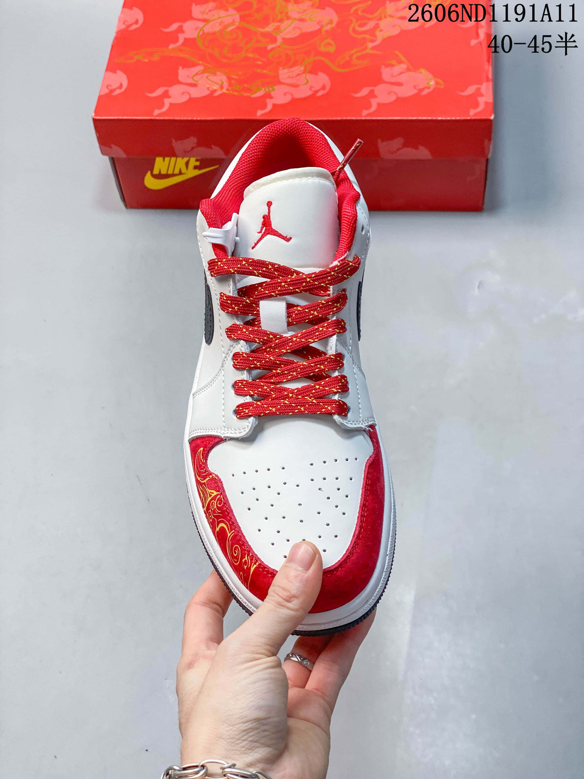 Top-down view showing the white perforated toe, red trim, red tongue lining, and patterned laces.