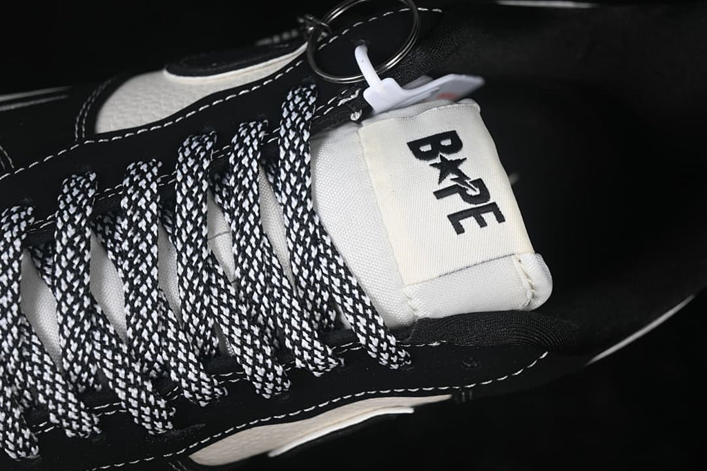 Close-up of the tongue label and black-and-white patterned laces.