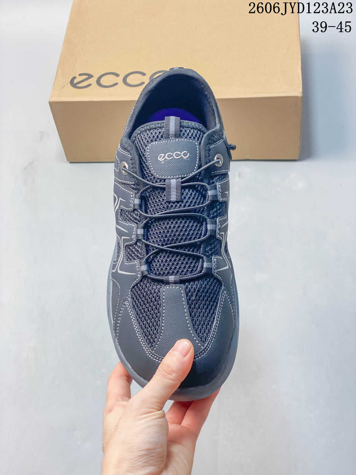 Top view of the gray lace-up shoe with mesh panels and rounded toe