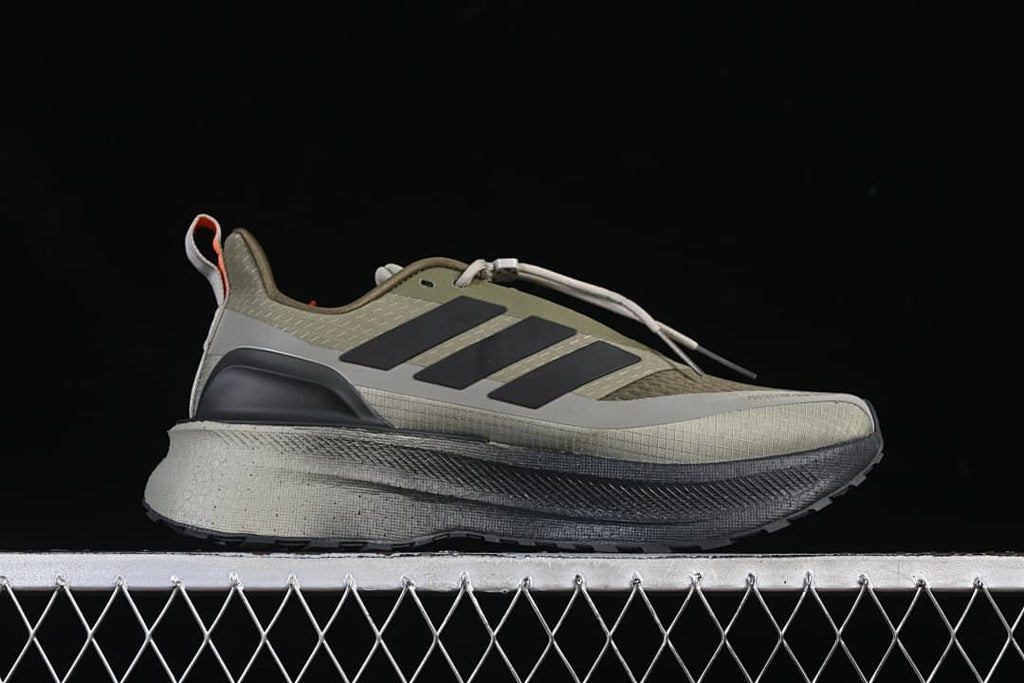 Side profile showing the olive and gray upper and layered sole
