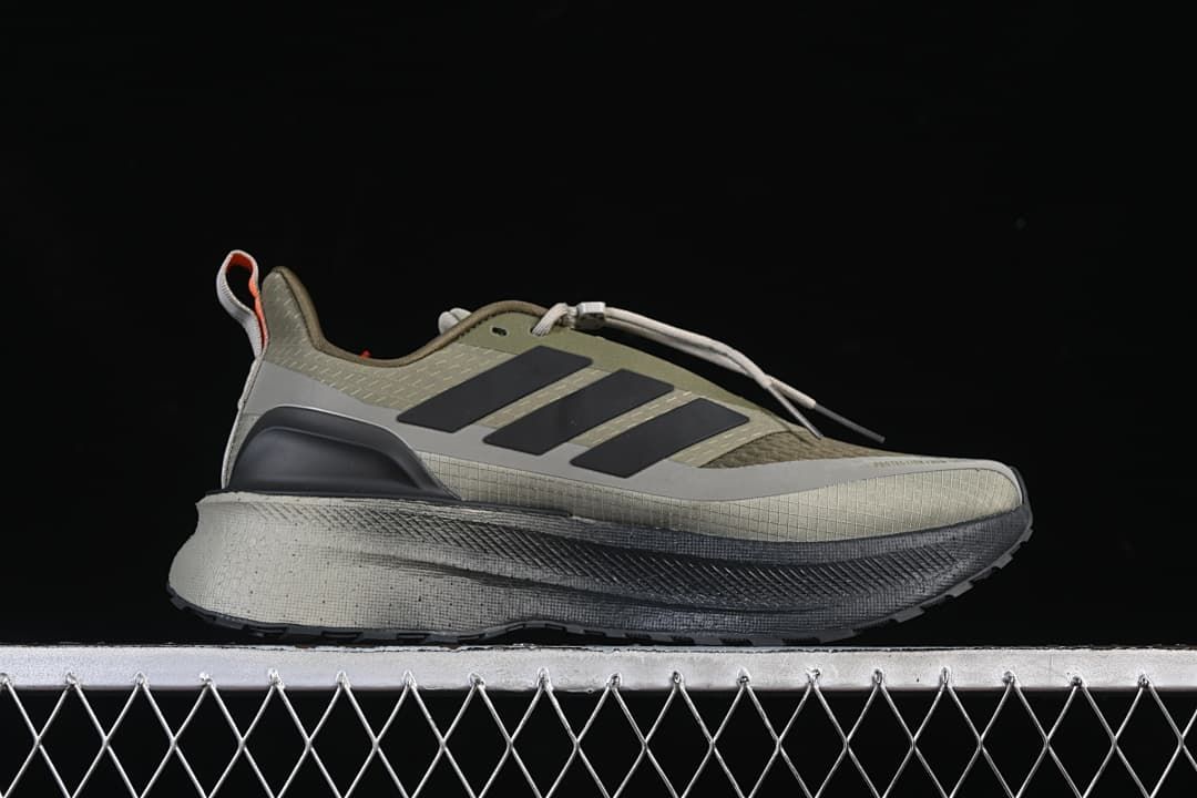 Side profile showing the olive and gray upper and layered sole