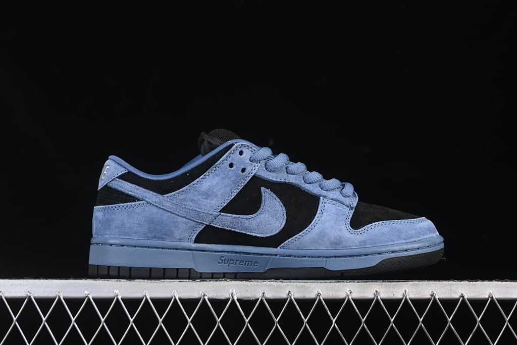 Side profile of the low-top sneaker showing the Swoosh and blue midsole