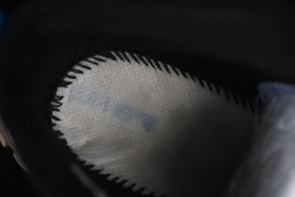 Close-up view inside the boot showing the lining and interior construction