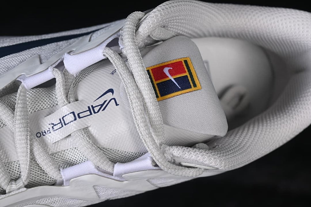 Top-down detail of the laces, tongue branding, and padded collar.