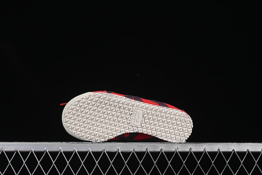 Underside showing the light-colored patterned outsole