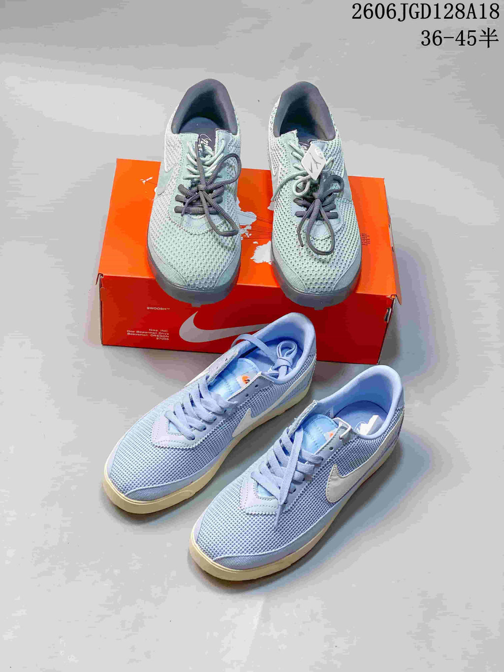 Several pale blue and gray-green Nike Astrograbber sneakers shown from above and at an angle.