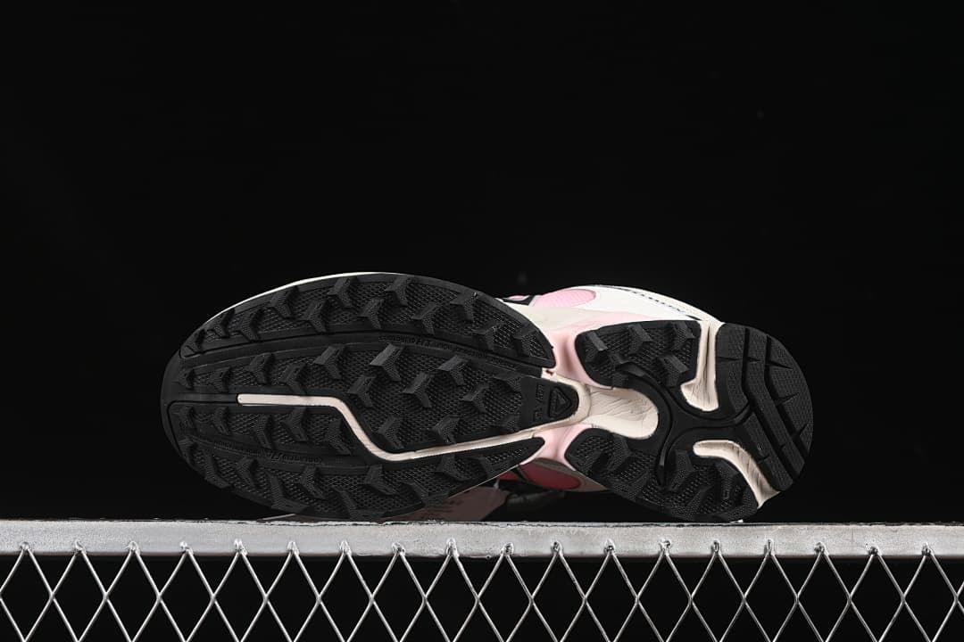 Underside view showing the black patterned outsoles