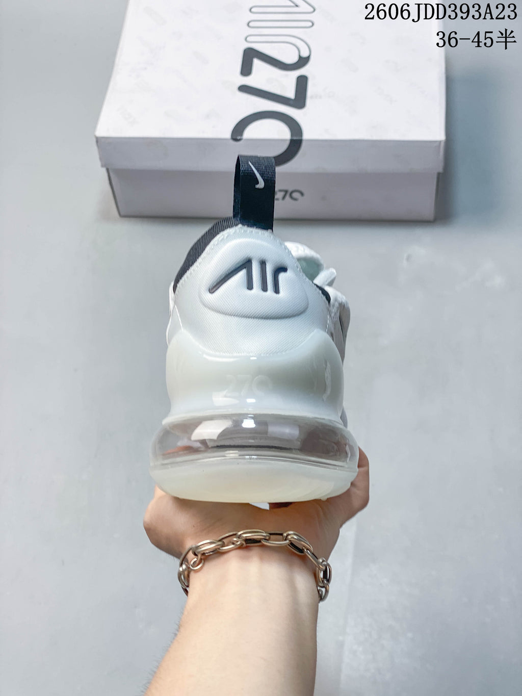 Rear view of a white Nike Air Max 270 sneaker with a visible heel unit