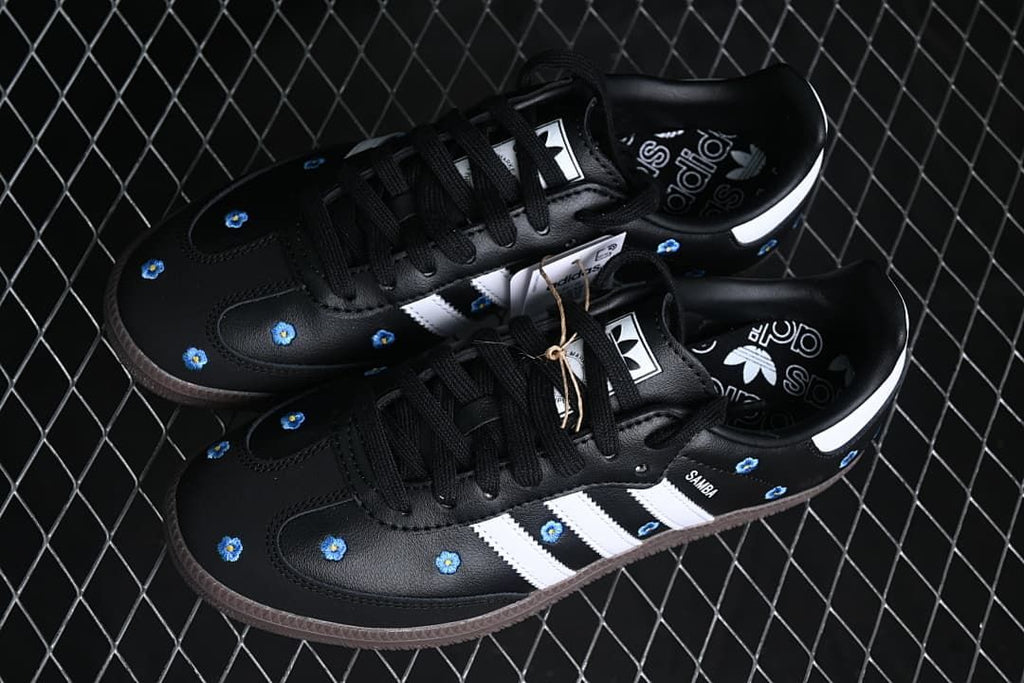 Pair of black floral Samba OG sneakers viewed from above