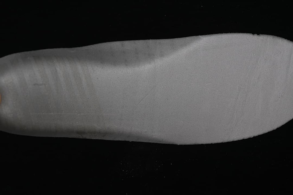 Close-up of the grey outsole surface.