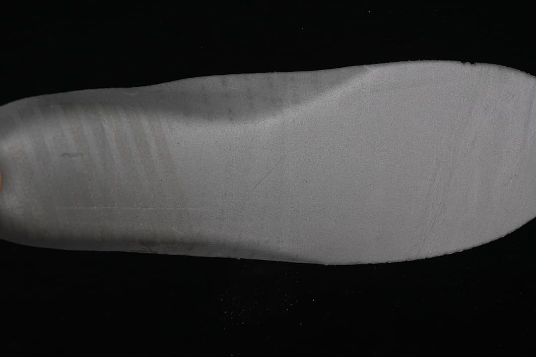 Close-up of the grey outsole surface.