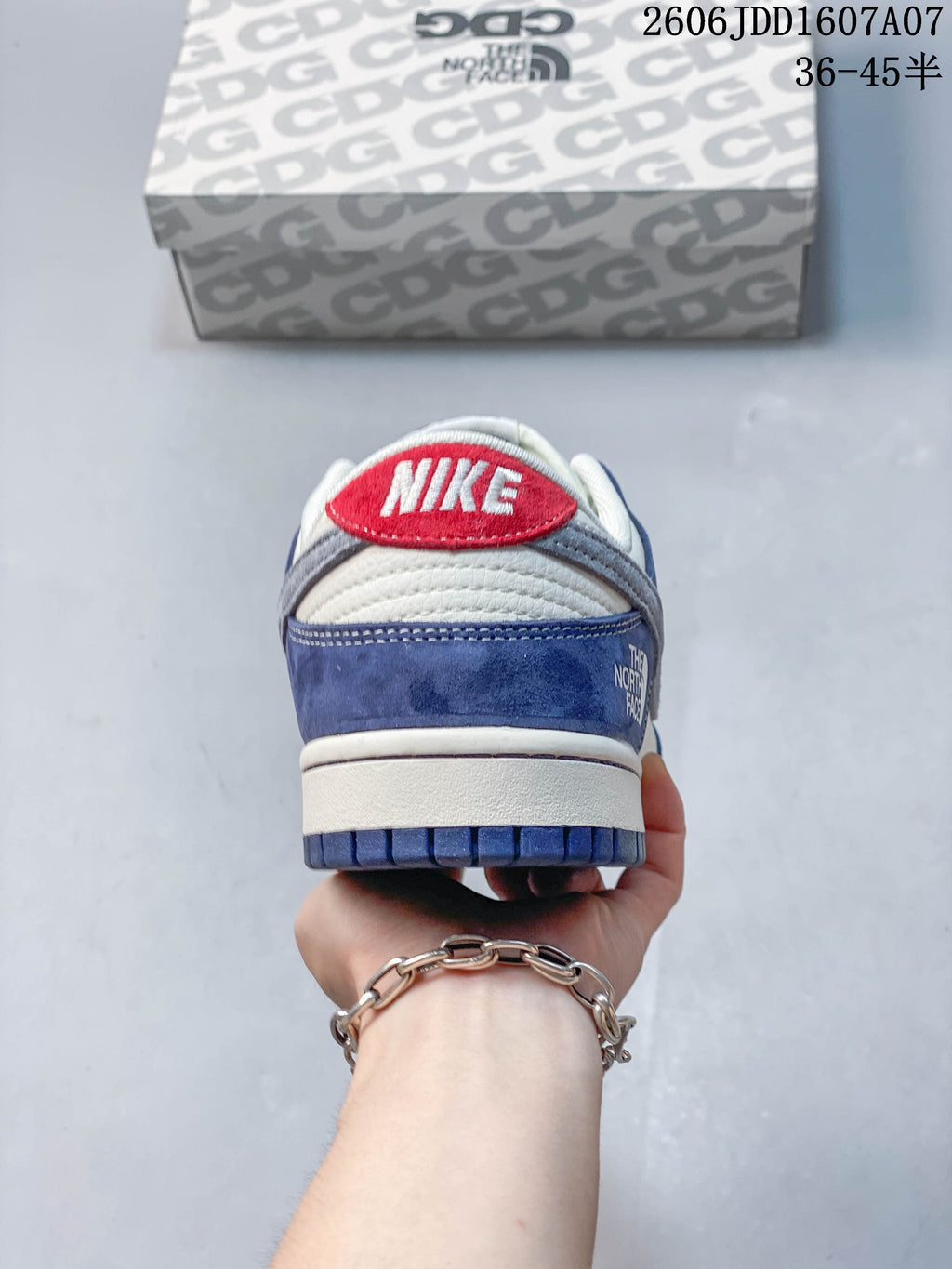 Rear view showing red heel detail and blue heel panel
