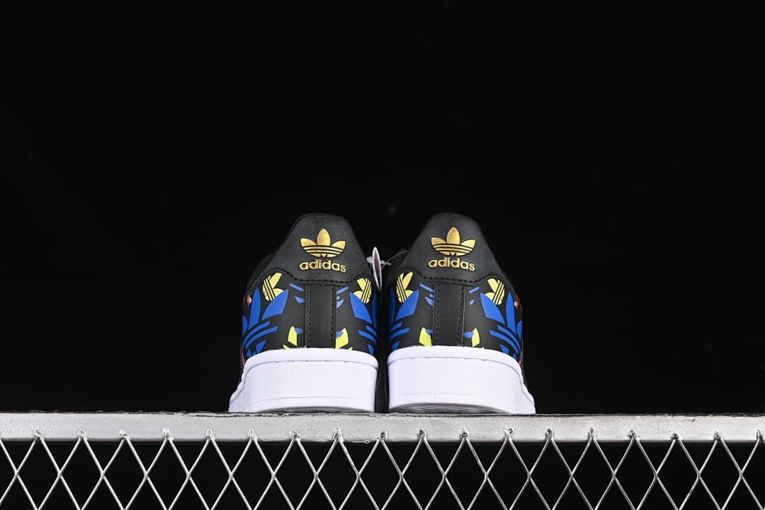 Rear view of both sneakers showing patterned heel panels