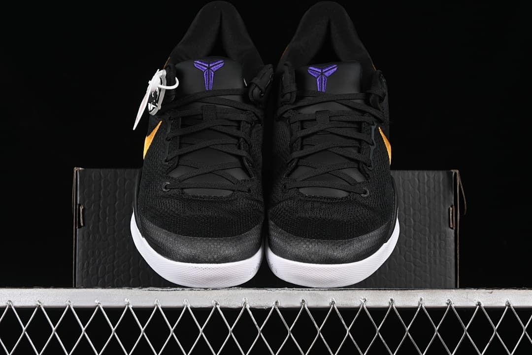 Front view of the pair showing black uppers, purple tongue logos and white soles