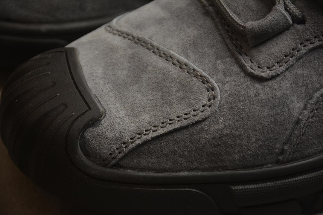 Close-up of the stitched toe overlay and protective-looking outsole edge.