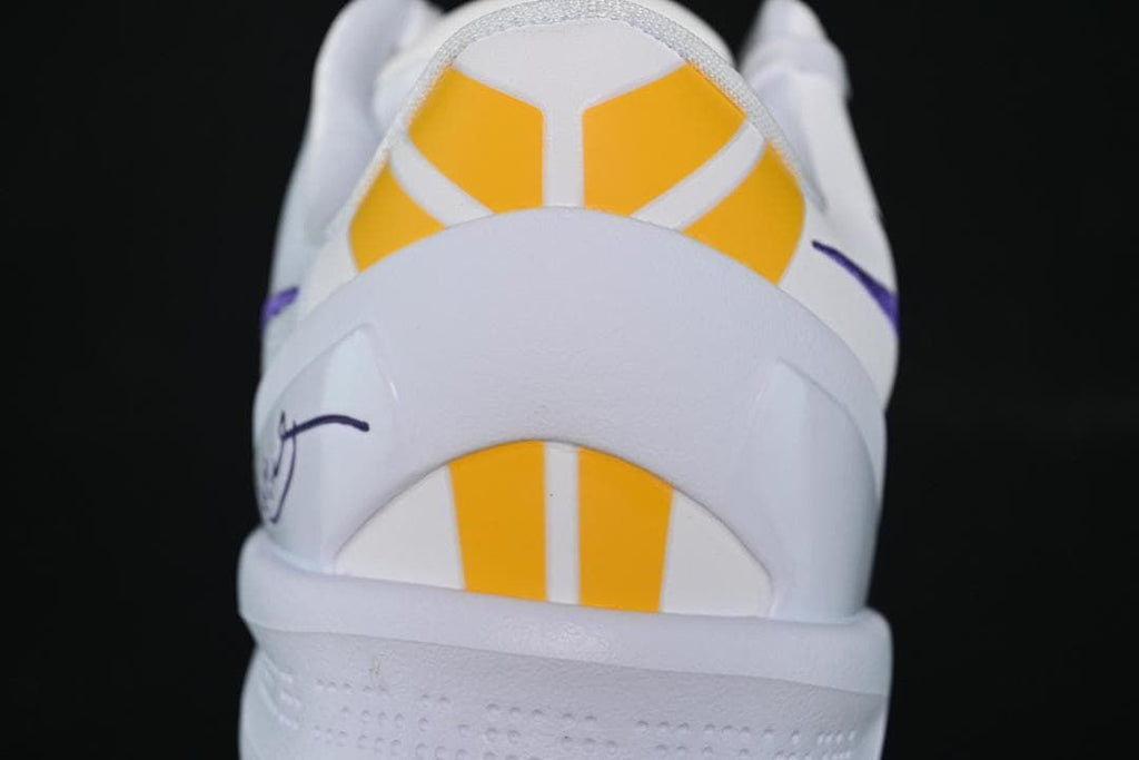 Rear view highlighting the yellow heel panels