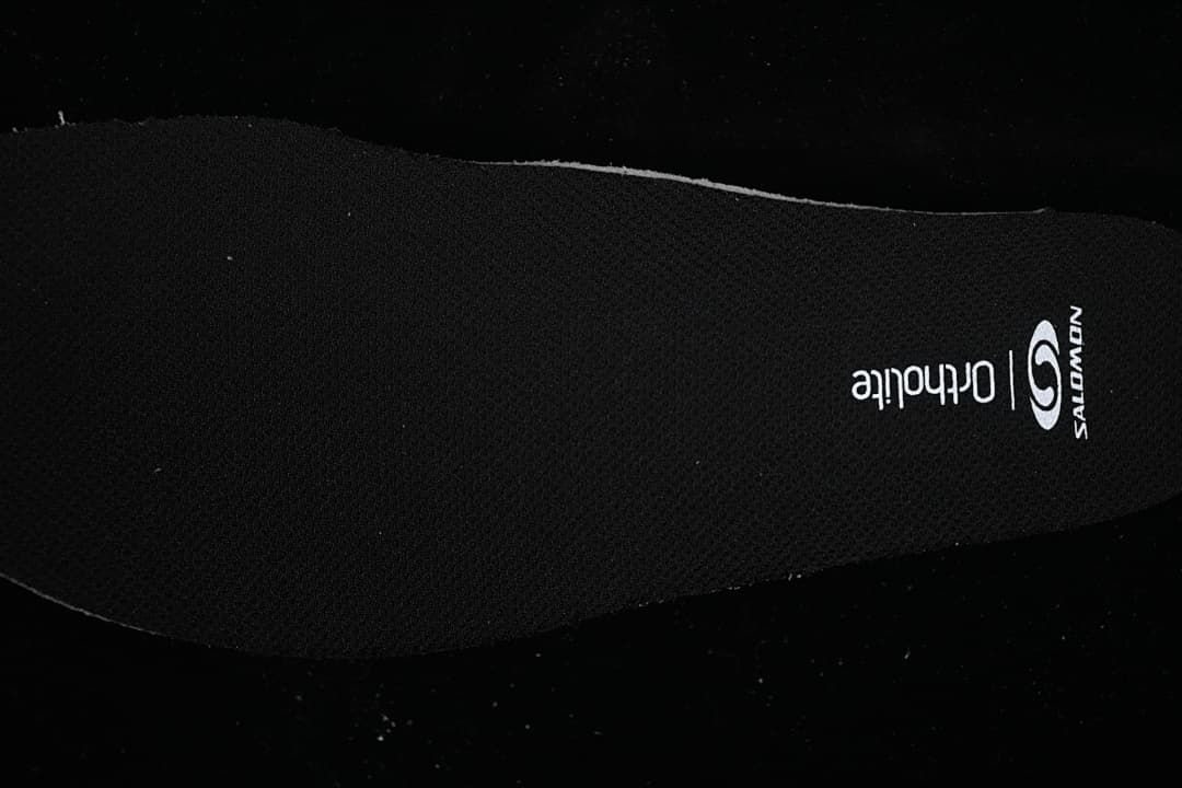 Close-up of the black insole with Salomon and Ortholite markings